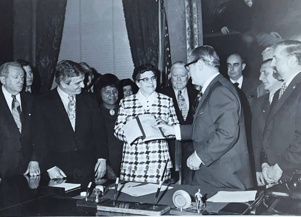 Picture of Evelyn M. Peck with Gov. Rockefeller
